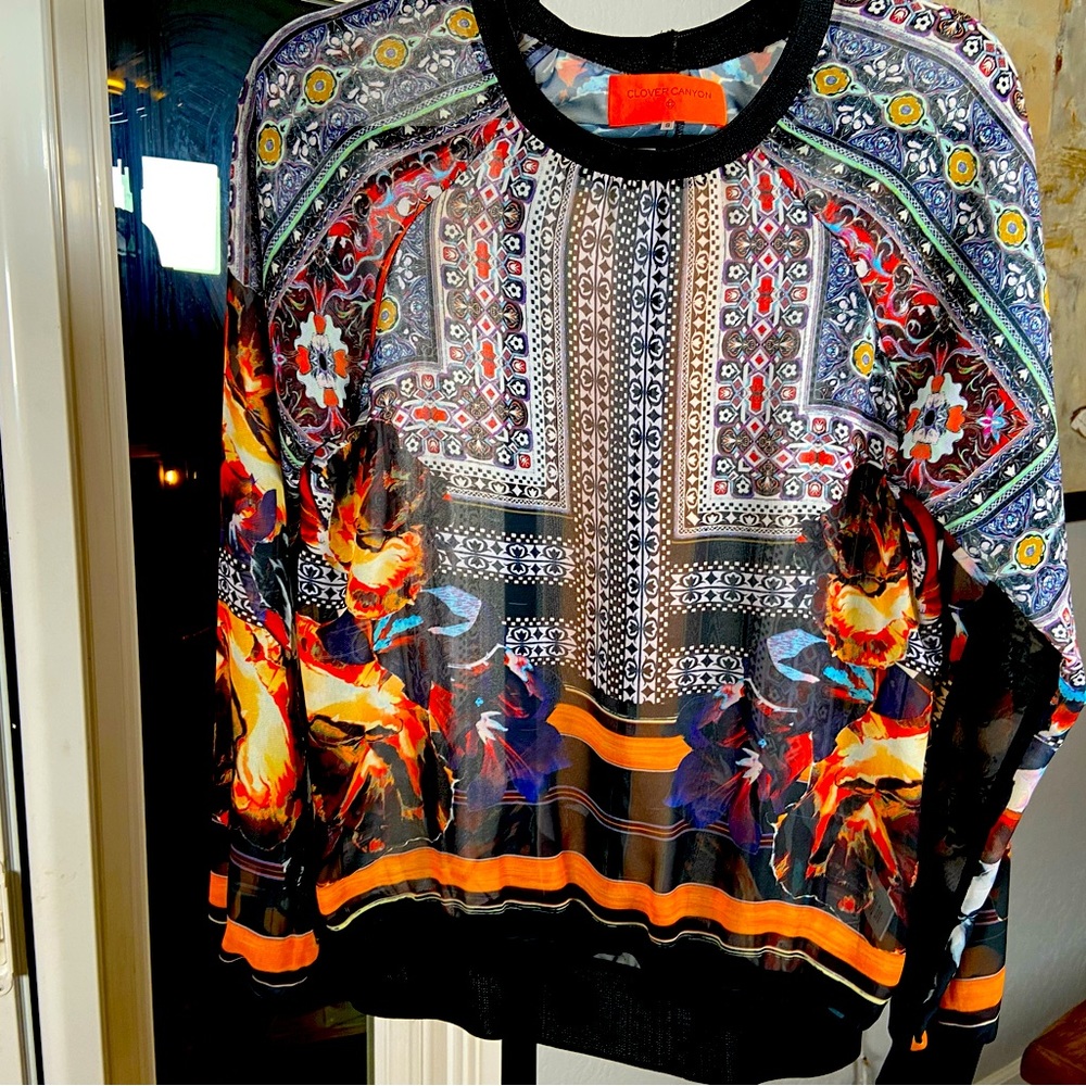 Multi color, pull over with elastic bottom.